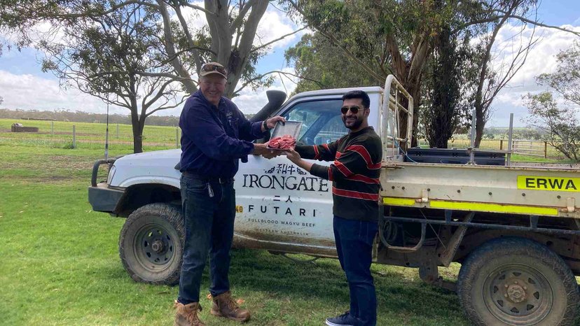 Owner of Futari Wagyu Peter Gilmour with Aviral Tlawar, from Du Soleil in India, looking over the wagyu beef at the Futari Farm in Two Peoples Bay. Credit: Supplied