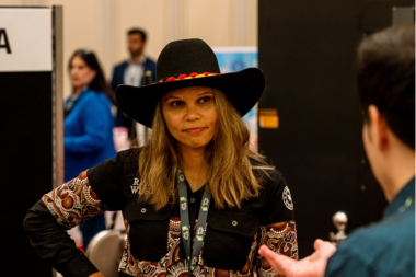 Zoe Davis standing at exhibition booth Djilz Ancient Bush Tea Meet the Buyer Buy West Eat Best